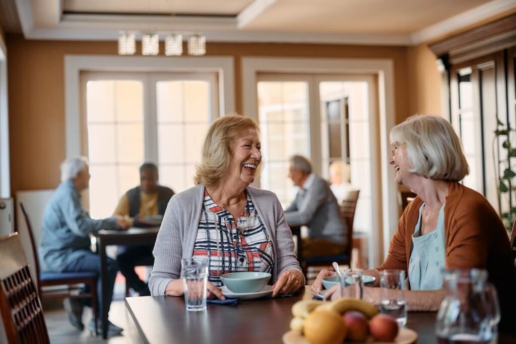 Two elderly women dining together